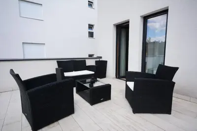 a room with chairs and tables on a building at Panorama LUX in Vrnjačka Banja