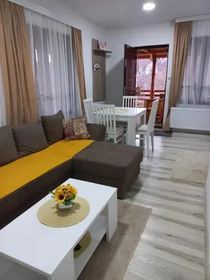 a living room with a couch and a table at Konak Jerma-Kanjon Jerme Pirot in Pirot