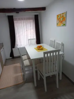 a white dining room table and chairs with fruit on it at Konak Jerma-Kanjon Jerme Pirot in Pirot
