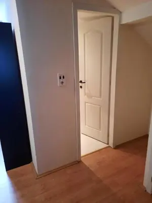 an empty room with an open white door at Ferienwohnung Süß in Kovanluk