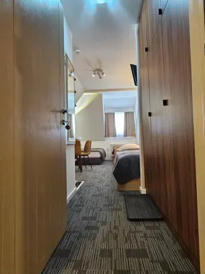 a room with a door leading to a bedroom at NevSki Apartments in Kopaonik