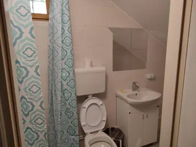 a small bathroom with a toilet and a sink at Sweet home B in Niš
