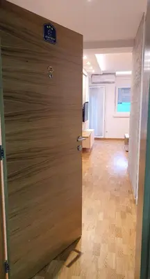 a door in an office with a sign on it at Verona 25 in Vrnjačka Banja
