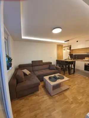 a living room with a couch and a table at Verona 25 in Vrnjačka Banja
