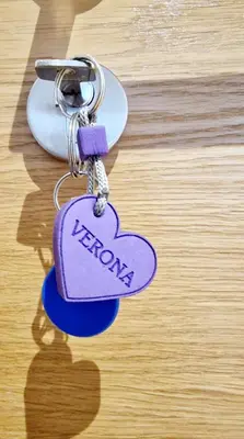 a key chain with a heart on it on a table at Verona 25 in Vrnjačka Banja