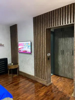 a room with a door and a painting on the wall at 32 in Jagodina