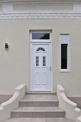 a white door on the side of a house at 4-teen in Jagodina