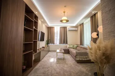 a living room with a couch and a table at VS Exclusive Luxury Wellness & Spa Apartmani - Vrnjačka Banja in Vrnjačka Banja