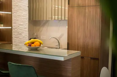 a bowl of fruit on a counter in a kitchen at VS Exclusive Luxury Wellness & Spa Apartmani - Vrnjačka Banja in Vrnjačka Banja