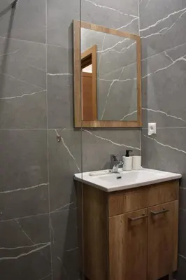 a bathroom with a sink and a mirror at President Kop A 409 - Wellness & Spa in Kopaonik