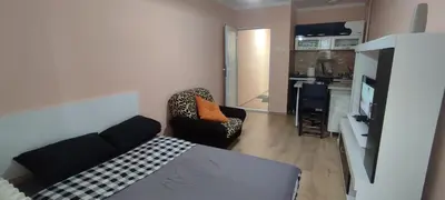 a room with a bed and a couch and a chair at Stan na dan Bor in Bor