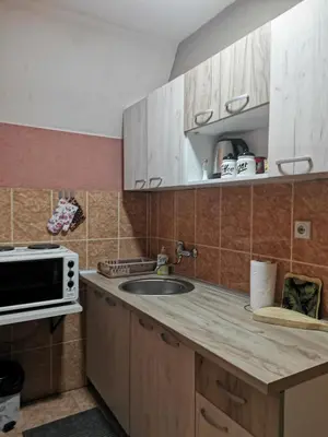 a kitchen with a sink and a microwave at Vikendica Čeperković #1 in Kopaonik