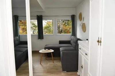 a living room with a couch and a table at Vikendica Čeperković #1 in Kopaonik