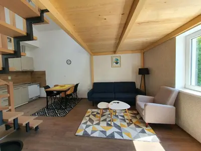 a living room with a couch and a table at Apartman Buena Vista in Soko Banja