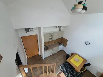 an overhead view of a small kitchen with a table at Apartman Buena Vista in Soko Banja
