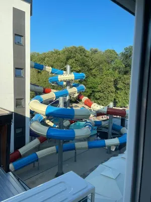a row of water slides on a cruise ship at Apartmani Central 8 & Free parking in Vrnjačka Banja
