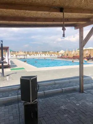 a view of a swimming pool with people in the water at STD JOVIC sa bazenom in Lebane
