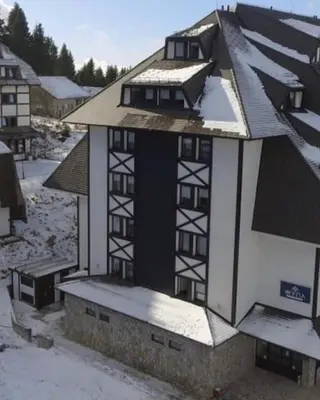 a building with snow on the side of it at Kopaonik Župa 505 in Kopaonik