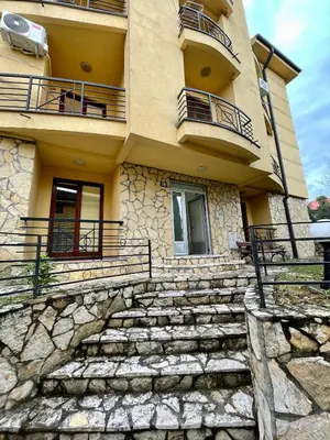 a building with stairs in front of it at Apartman FiliAki in Vrnjačka Banja