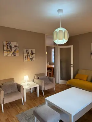 a living room with a couch and chairs and a table at Lala Lux & Parking free in Soko Banja