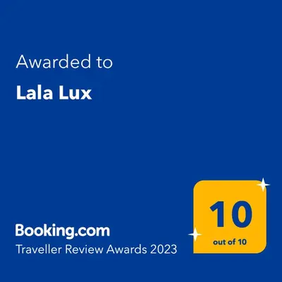 a yellow sign with the text awarded to la lix at Lala Lux & Parking free in Soko Banja