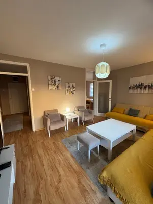 a living room with a couch and a table at Lala Lux & Parking free in Soko Banja