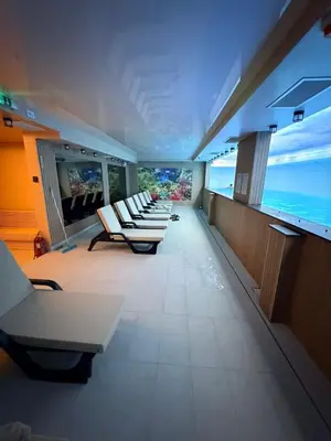 a row of chairs in a room with an aquarium at Apartman Skyline Kopaonik in Kopaonik