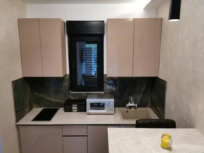 a kitchen with a sink and a microwave at EHINACEA in Rtanj