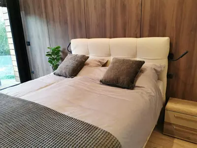 a large white bed with two pillows on it at EHINACEA in Rtanj