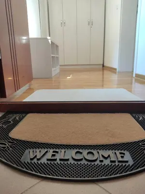 a welcome mat on the floor of a room at Magic Dream Lux apartman in Vrnjačka Banja