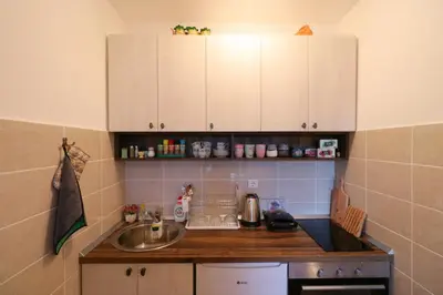 a kitchen with a sink and a counter top at Magic Dream Lux apartman in Vrnjačka Banja