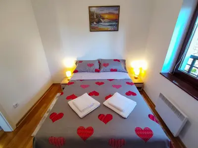 a bedroom with a bed with hearts on it at Magic Dream Lux apartman in Vrnjačka Banja