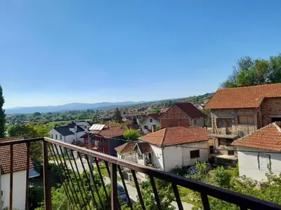 a view from a balcony of a town with houses at Beli Ocnjak in Soko Banja
