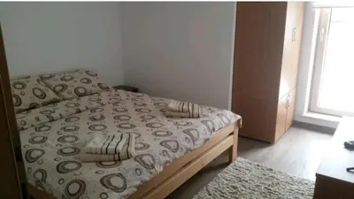 a small bedroom with a bed and a window at M & M in Vrnjci