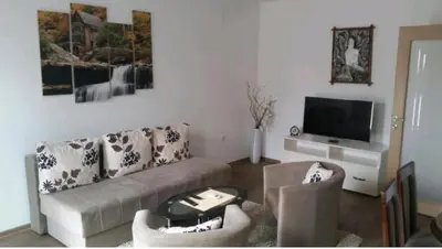 a living room with a couch and a tv at M & M in Vrnjci