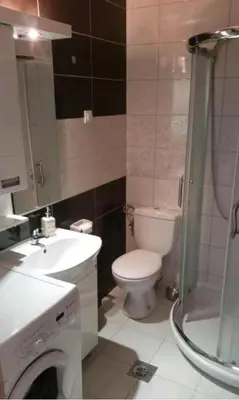 a bathroom with a toilet and a sink and a shower at M & M in Vrnjci