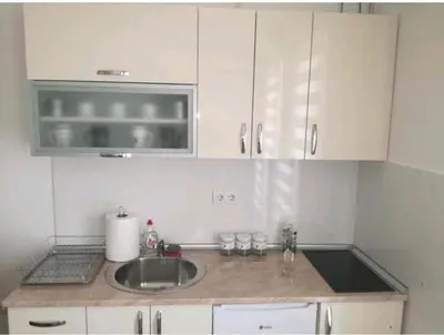 a kitchen with a sink and a microwave at M & M in Vrnjci