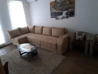 a living room with a couch and a coffee table at M & M in Vrnjci