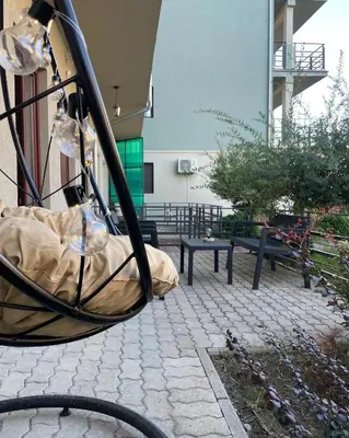 a view of a patio with benches in a building at Apartman 5 Vrnjačka Banja in Vrnjačka Banja