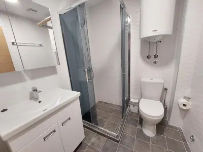 a bathroom with a toilet and a shower and a sink at KATARINA - Lux two bedroom apartment in ski resort Kopaonik in Kopaonik