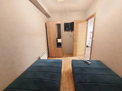 a living room with a couch and a door at KATARINA - Lux two bedroom apartment in ski resort Kopaonik in Kopaonik