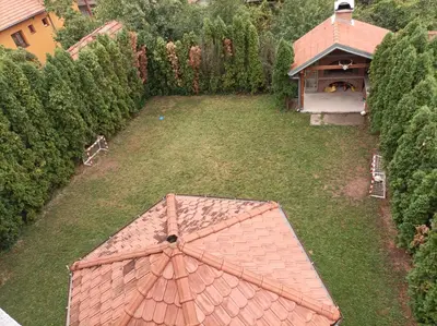 an overhead view of a large umbrella in a yard at NiTex Studio in Soko Banja
