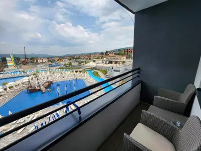 a balcony with a view of a swimming pool at Apartman Minja in Vrnjačka Banja