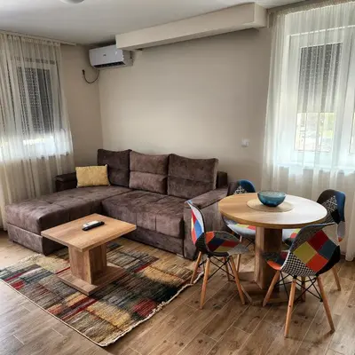 a living room with a couch and a table at Apartman Minja in Vrnjačka Banja