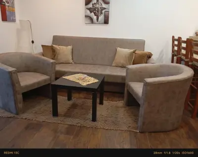 a living room with a couch and two chairs and a table at MIN apartman Goc in Vrnjačka Banja