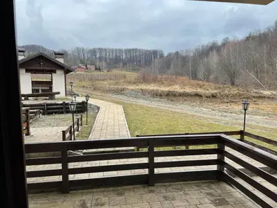 a view from the porch of a building with a fence at MIN apartman Goc in Vrnjačka Banja