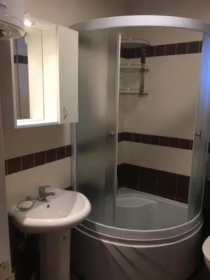 a bathroom with a shower and a sink and a tub at Lux Apartman Holiday-Brzeće, Kopaonik in Brzeće