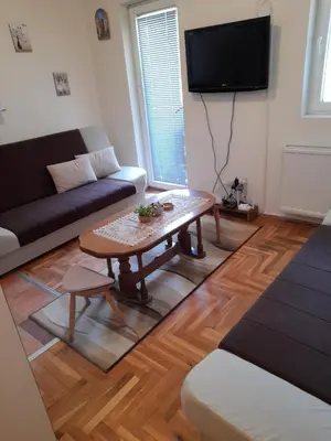 a living room with a coffee table and a couch at N&N in Brzeće