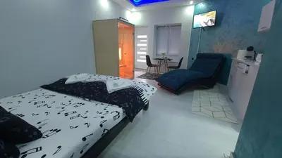 a bedroom with a bed with birds on it at Apartman Melody in Paraćin