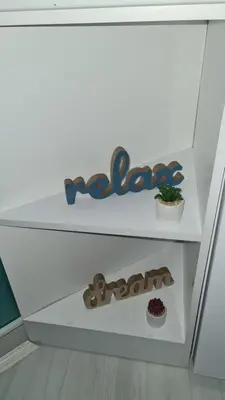 a white drawer with a sign that reads urgent at Apartman Melody in Paraćin